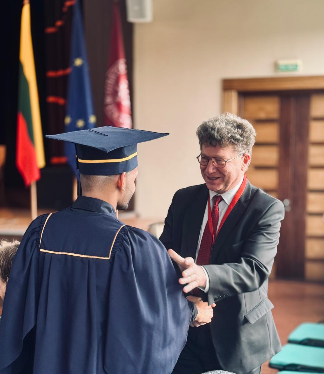 LevelUp graduate receiving diploma on stage in Lithuania