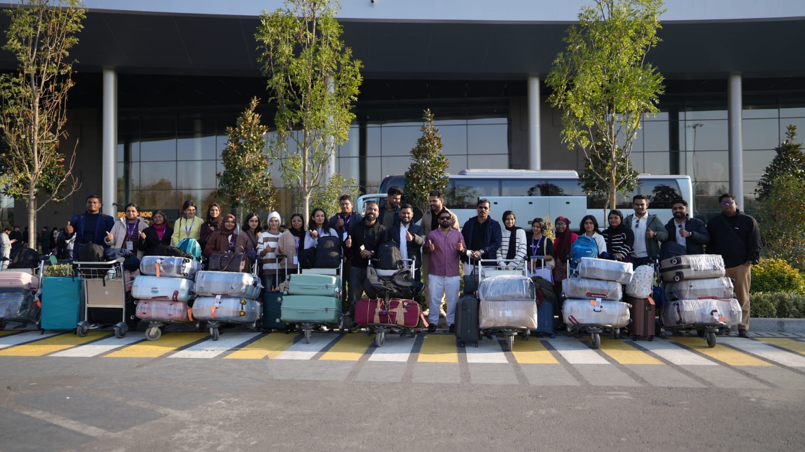 Group of LevelUp students with luggage trolleys at Cochin International Airport